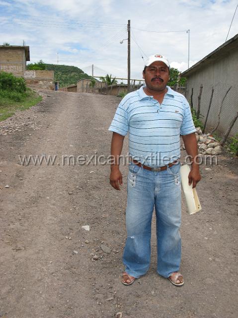 tula del rio19.JPG - An official of the town carrying plans for some construction work to be done in town. this town really impressed me , given its isolation for so many years there was a great deal of infrastructure modernization in the town.